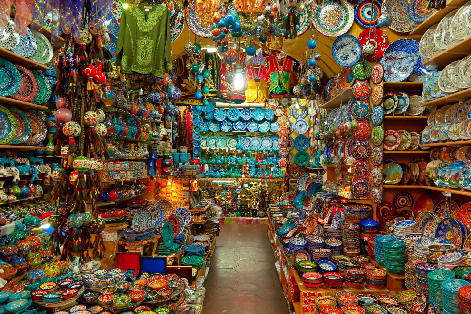 Photograph of a colorful, crowded shop full of plates, bowls, and other items