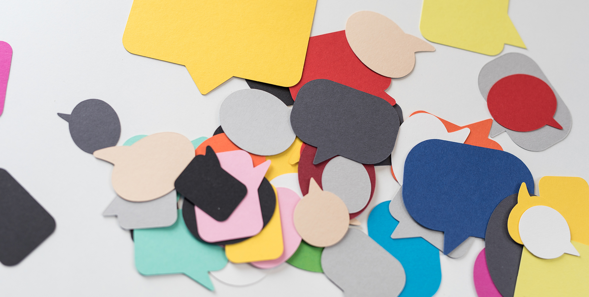 Image of colorful cut-outs of speech bubbles