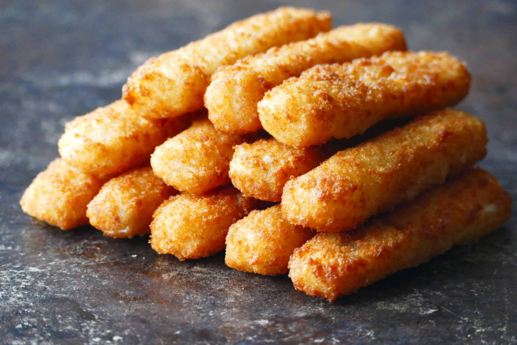 Photograph of a pyramid of fish sticks.