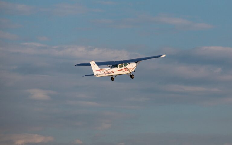 Photograph of a small airplane in the air