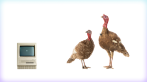 Image of an old Mac and two turkeys against a white background.