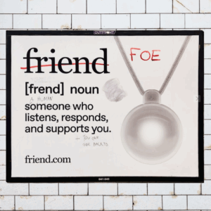 Image of a Friend ad on a subway wall with "friend" crossed out and FOE written in red.