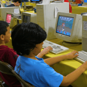 Photograph of children on 90s-style computers.