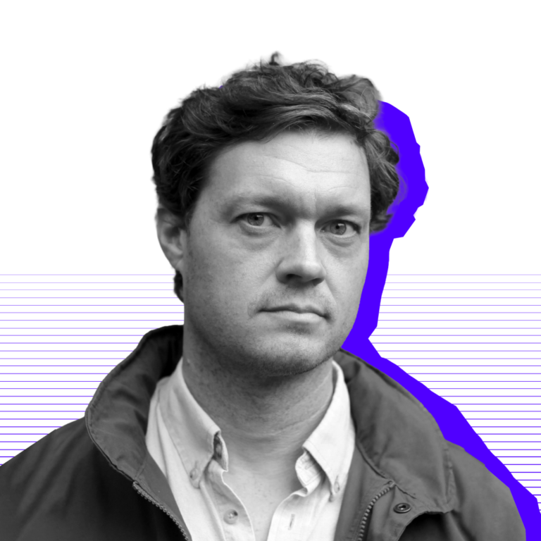 Black and white image of Evan with a purple shadow, set against faint purple lines on a white background.