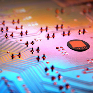 Image of a motherboard in shades of orange, pink, and blue.