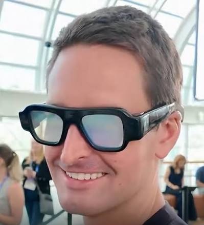 Photo of Evan Spiegel wearing the very ugly Snap glasses