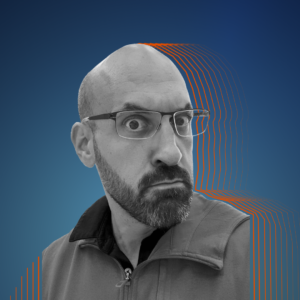 Black and white image of Jason against a dark blue background, with orange lines silhouetting him.